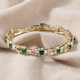 Pulseira tennis elegante com elos verdes | Dourado