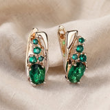 Brincos dourados elegantes Thessaly Moressin