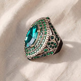 Anel dourado elegante Regent com esmeralda