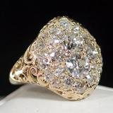 Anel vintage em dourado com diamante redondo brilhante