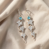 Brincos pendentes elegantes com folha de safira
