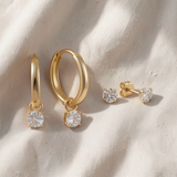 Conjunto elegante de brincos dourados com pedras brilhantes